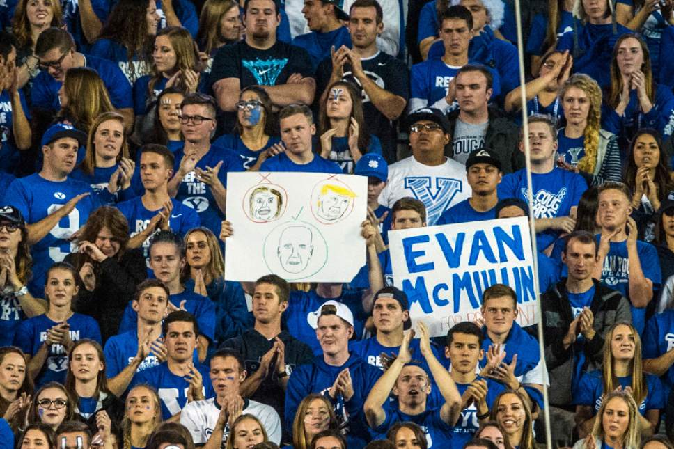 Chris Detrick  |  The Salt Lake Tribune
Brigham Young Cougar fans hold up a signs during the game at LaVell Edwards Stadium Friday October 14, 2016. Brigham Young Cougars defeated Mississippi State Bulldogs 28-21in double overtime.