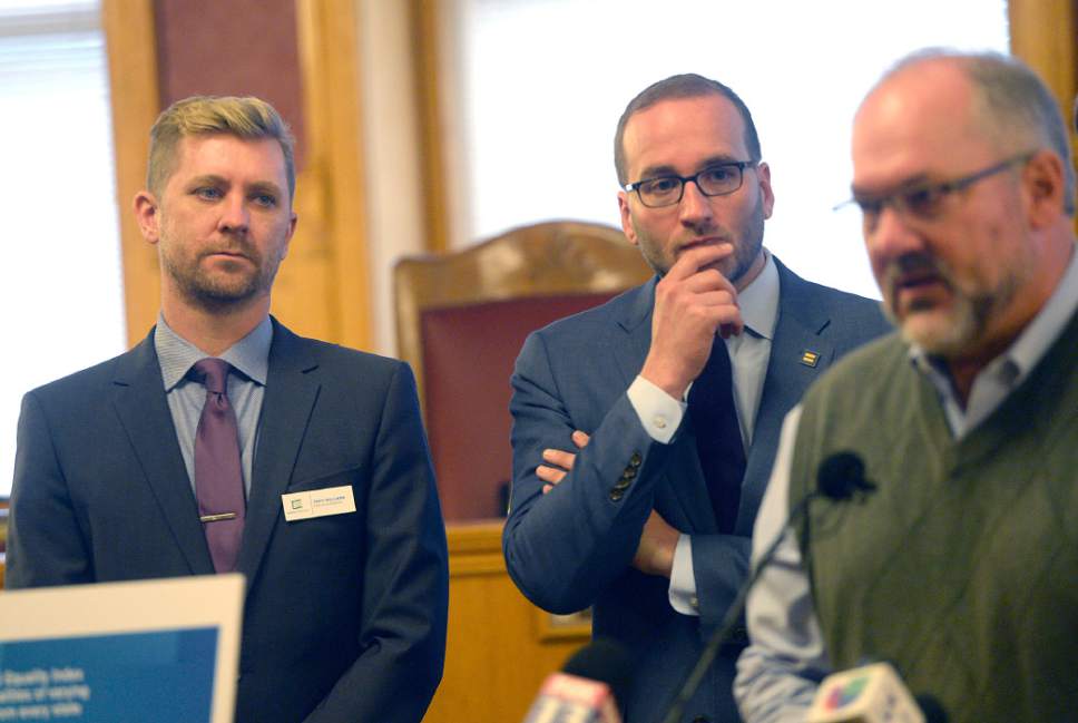 Al hartmann  |  The Salt Lake Tribune 
Troy Williams with Equality Utah, left, and Chad Griffin, President of Human Rights Campaign listen to Salt Lake City Councilman Stan Penfold speak on the Human Rights Campaign report results of the city's score at the City-County Building Monday October 17.  It showed Salt Lake City earning a better than average score among U.S. cities when judged on its policies and practices of including lesbian, gay, bisexual, transgender and queer citizens.  Behind him are Troy Williams, left, and Bruce Bastian with Equality Utah. 
The survey conducted by the Human Rights Campaign, the Metropolitan Equality Index is the only national assessment of LGGBTQ inclusion in municipal law and policy. 
A record 506 cities were evaluated for the report, with 60 cities earning a perfect score of 100.
Salt Lake City earned the highest ranking ó 69 ó among the eight Utah cities included in the survey.