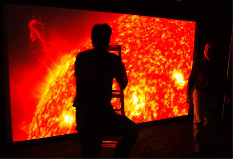 Steve Griffin | The Salt Lake Tribune


Planetarium staff members put the finishing touches on an exhibit that displays activity on the surface of the sun, one of the Clark Planetarium's revamped exhibits unveiled Monday, Oct. 17, 2016, in Salt Lake City. The Planetarium is planning a "Ready, Set, Relaunch" party on Saturday.