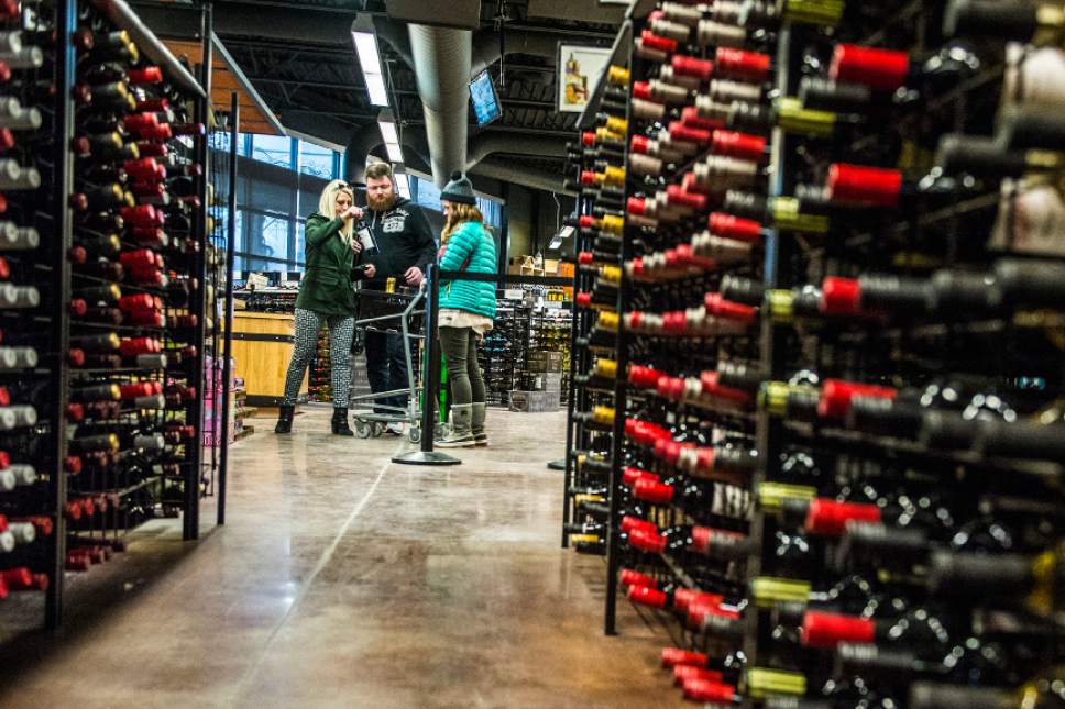 Chris Detrick  |   Tribune file photo
The Utah Wine Store, 280 Harris Ave S in Salt Lake City stocks wine in January. Two pieces of legislation would increase funding for the Utah DABC.