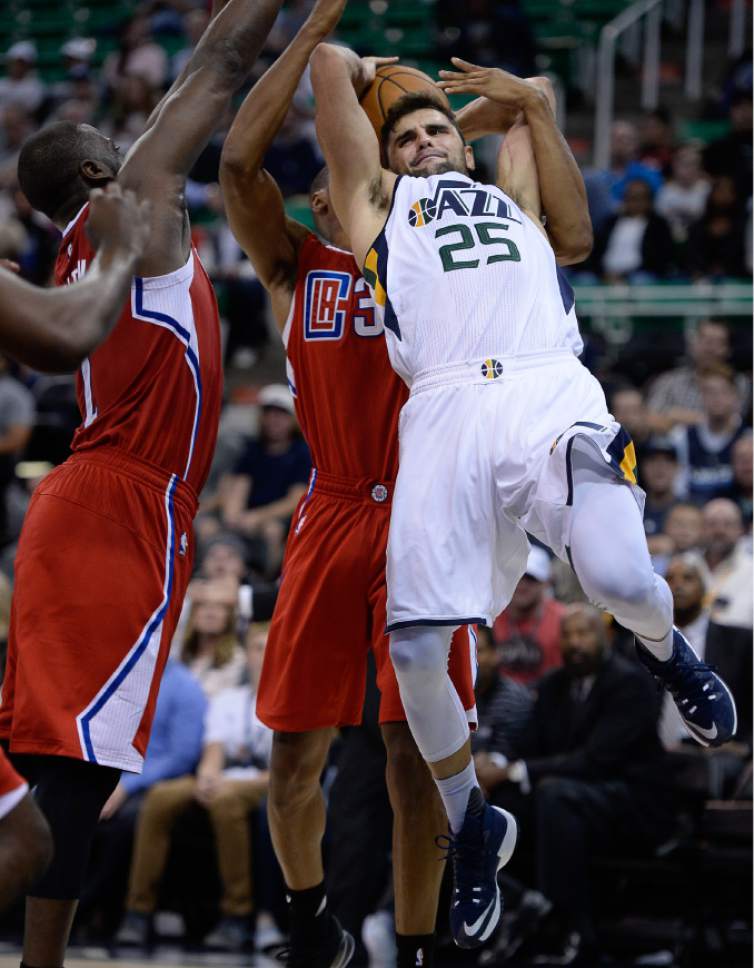 Francisco Kjolseth | The Salt Lake Tribune
Los Angeles Clippers guard Raymond Felton (2) and Los Angeles Clippers forward Wesley Johnson (33) stop any forward momentum of Utah Jazz guard Raul Neto (25) before he hits the deck in game action at Vivint Smart Home Arena on Monday, Oct. 17, 2016, with a Jazz win of 104-78.
