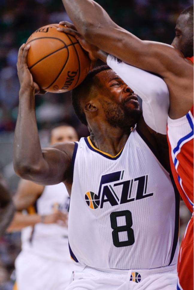 Francisco Kjolseth | The Salt Lake Tribune
Utah Jazz guard Shelvin Mack (8) gets an arm full from Los Angeles Clippers guard Raymond Felton (2) in game action at Vivint Smart Home Arena on Monday, Oct. 17, 2016, with a Jazz win of 104-78.