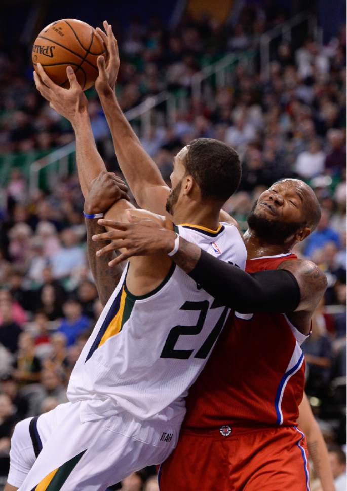 Francisco Kjolseth | The Salt Lake Tribune
Utah Jazz center Rudy Gobert (27) is strong armed by Los Angeles Clippers center Marreese Speights (5) in game action at Vivint Smart Home Arena on Monday, Oct. 17, 2016, with a Jazz win of 104-78.