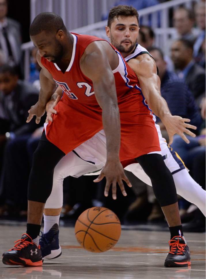 Francisco Kjolseth | The Salt Lake Tribune
Los Angeles Clippers guard Raymond Felton (2) gets pressured by Utah Jazz guard Raul Neto (25) at Vivint Smart Home Arena on Monday, Oct. 17, 2016, with a Jazz win of 104-78.