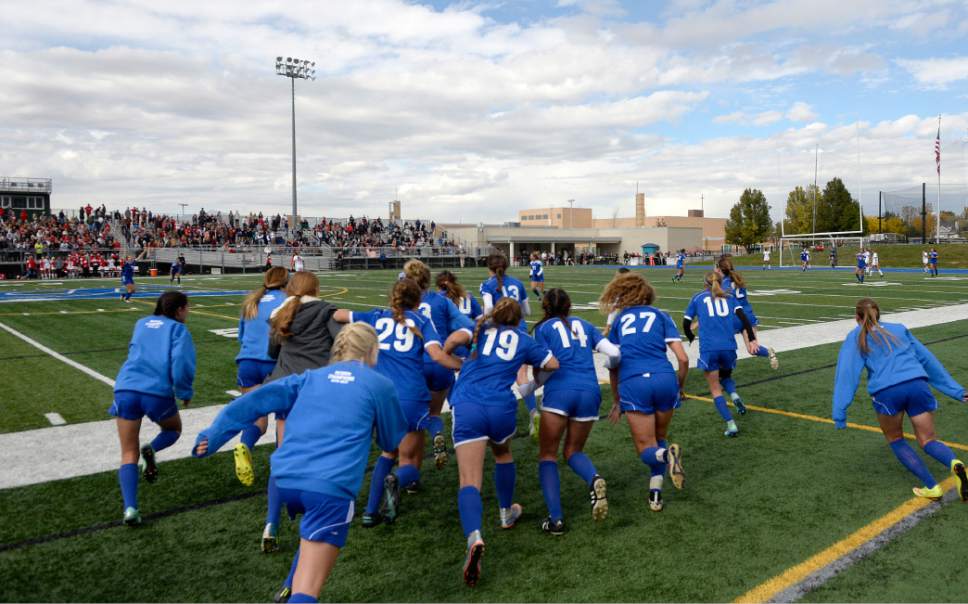 Al Hartmann  |  The Salt Lake Tribune
Fremont High School soccer players on the sidelines rush the field to join teammates on field as time runs out beating American Fork High School 1-0 in 5A semifinal Girl's Soccer match  School Tuesday Oct. 18.