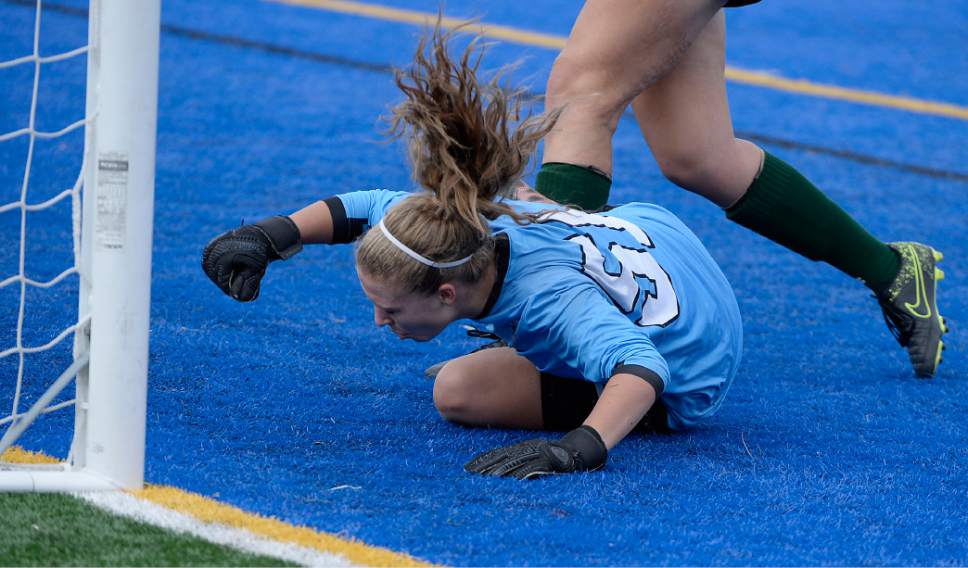 Al Hartmann  |  The Salt Lake Tribune
Ball sails into the net past Copper Hills goalee Ashley Sargent in 5A semifinal Girl's Soccer match Tuesday Oct. 18 agaisnt Davis High School.  The goal came in the first 30 seconds of the match.