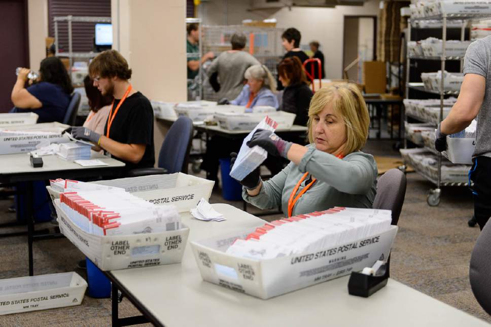 Trent Nelson  |  The Salt Lake Tribune
Employees in Salt Lake County's Election Division prepare mail in ballots to be sorted and counted at the Salt Lake County Government Center in Salt Lake City, Tuesday October 18, 2016.