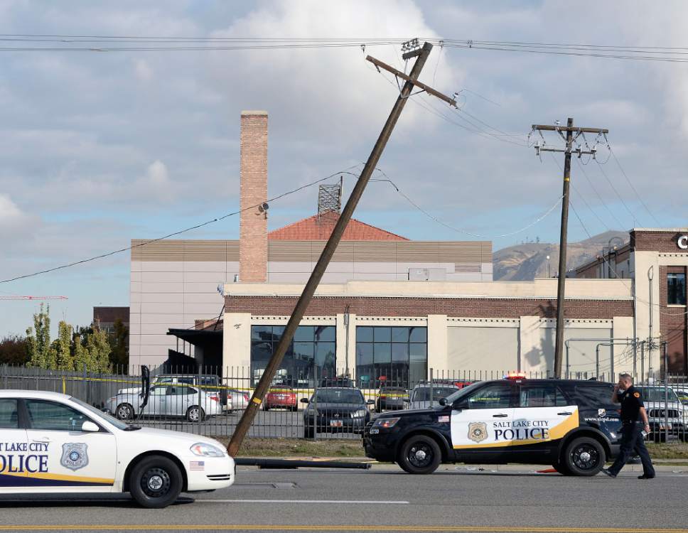 Al Hartmann  |  The Salt Lake Tribune
Salt Lake City Police and emergency paramedics respond to an accident scene at 500 West and 400 South where a westbound truck lost control striking a power pole and injuring two pedestrians Wednesday about 9:30 a.m. October 19.