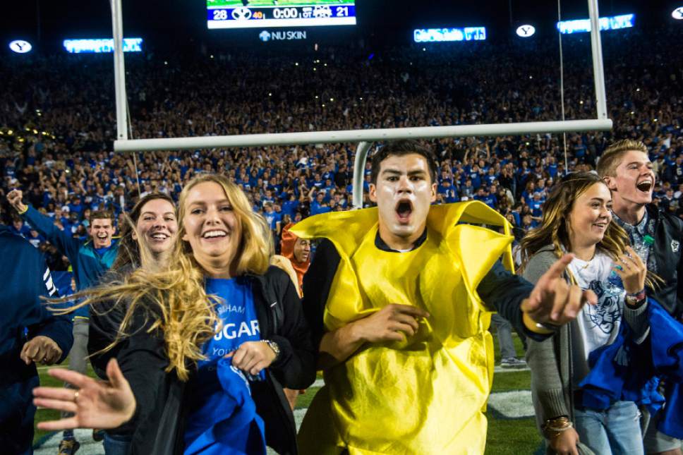 Chris Detrick  |  The Salt Lake Tribune
Brigham Young Cougar fans celebrate after the game at LaVell Edwards Stadium Saturday October 15, 2016. Brigham Young Cougars defeated Mississippi State Bulldogs 28-21in double overtime.