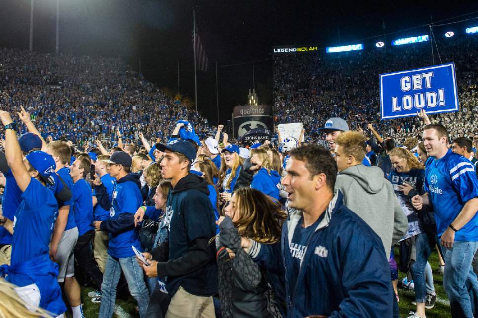 Chris Detrick  |  The Salt Lake Tribune
Brigham Young Cougar fans celebrate after the game at LaVell Edwards Stadium Saturday October 15, 2016. Brigham Young Cougars defeated Mississippi State Bulldogs 28-21in double overtime.