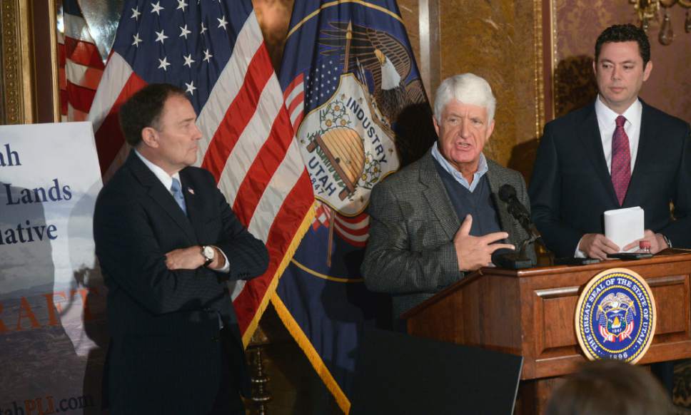 Al Hartmann  |  Tribune file photo
Utah Congressman Rob Bishop, center, with Utah Gov. Gary Herbert, left, and Rep. Jason Chaffetz, right, unveil a "discussion draft" of their Public Lands Initiative bill affecting 18 million acres in seven eastern Utah counties at the State Capitol Tuesday Jan. 20.