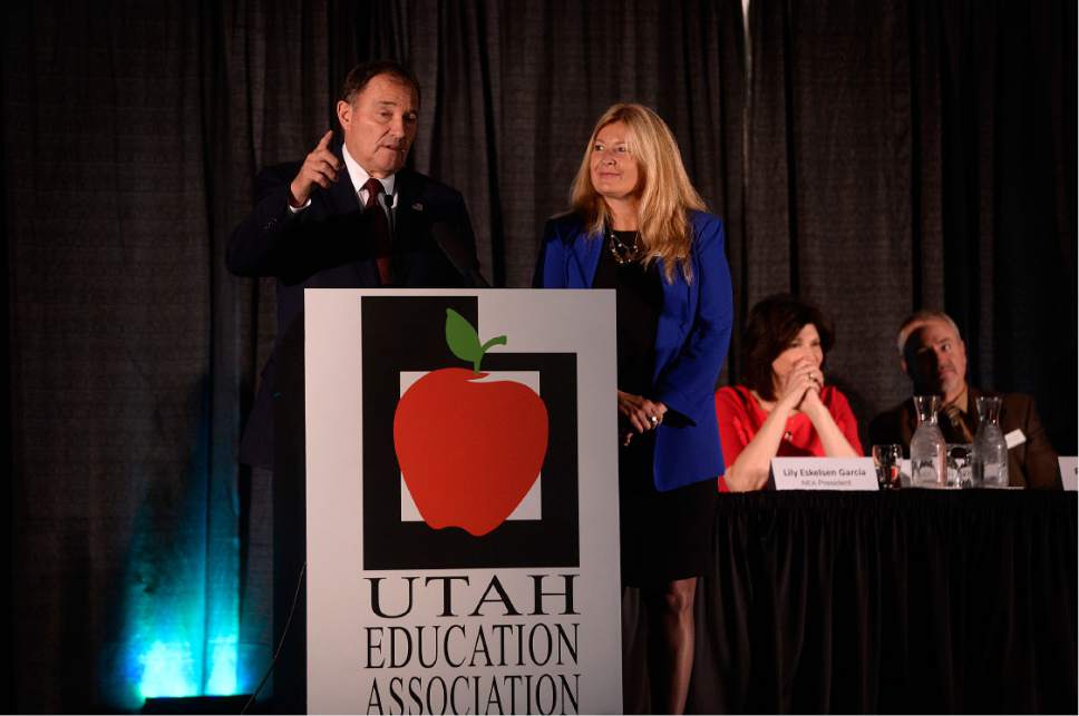 Scott Sommerdorf   |  The Salt Lake Tribune  
UEA President Heidi Matthews waits as Utah Governor Gary Herbert finishes his talk during the opening of the National Education Association Convention, Thursday, October 20, 2016.