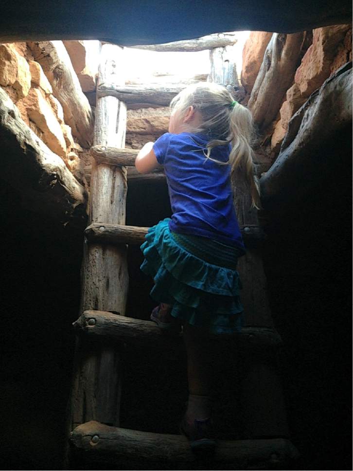Erin Alberty  |  The Salt Lake Tribune

A young hiker descends the latter through the ceiling of a a restored underground dwelling, called a kiva, at Edge of the Cedars State Park on June 11, 2016 in Blanding.