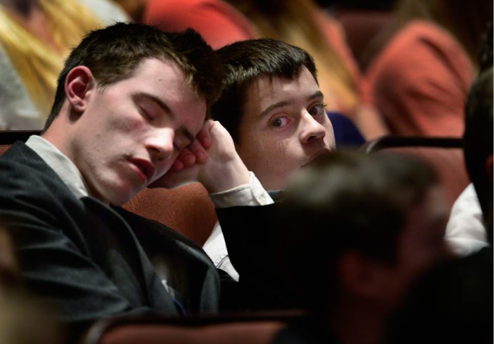 Scott Sommerdorf   |  The Salt Lake Tribune  
Two young men wait for the morning session of the 186th annual General Conference of the LDS Church to begin, Sunday, April 3, 2016.
