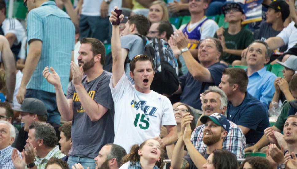 Rick Egan  |  The Salt Lake Tribune

Jazz fans cheer for Jerry Sloan, as he appears on the big screen, in Utah Jazz Summer League action, Utah Jazz vs. The Boston Celtics, at EnergySolutions Arena, Monday, July 6, 2015.