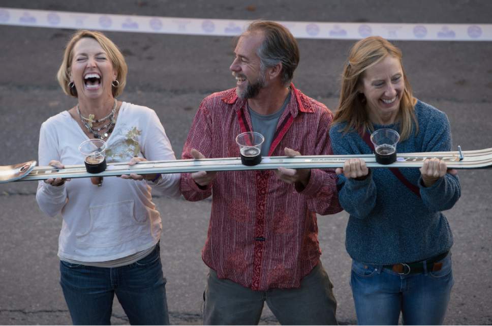 Leah Hogsten  |  The Salt Lake Tribune
Wasatch Brew Pub in Park City celebrated its 30th anniversary by attempting to break the world "shot-ski" record on Saturday. For the attempt, 1,191 people lined up on Main Street to raise one long ski -- 1,961-feet long with glasses attached-- for a shot of Wastach's premium ale.
