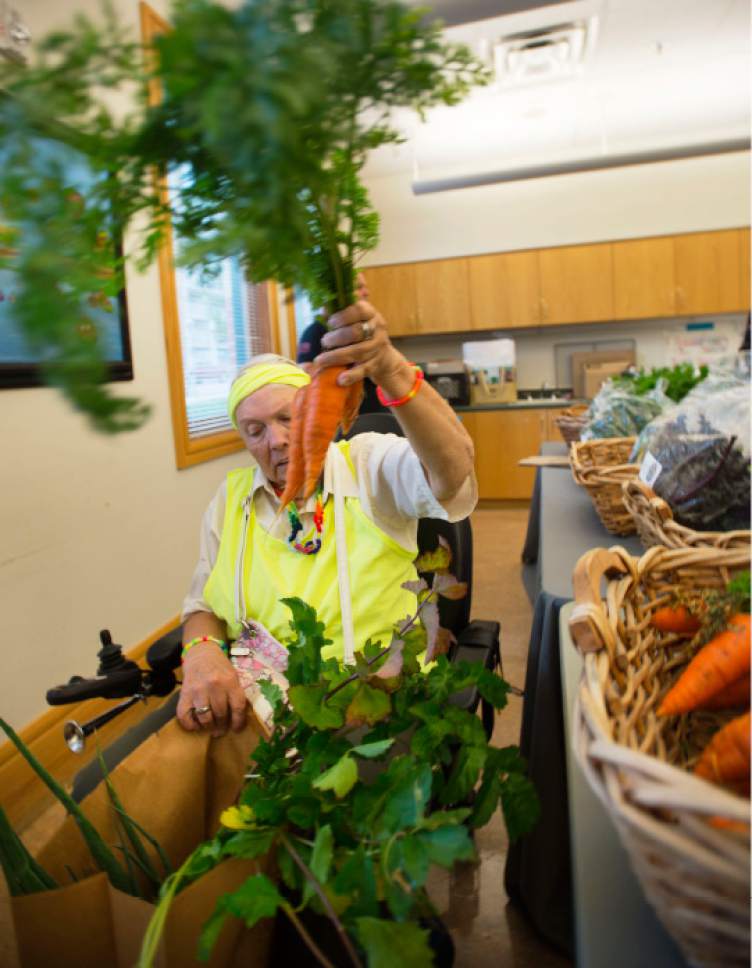 Steve Griffin / The Salt Lake Tribune


Winnie Walker puts a bunch of carrots into her bag during the Salt Lake County Jail Horticulture Program's modified farmers market for senior citizens at the Liberty Active Aging Center in Salt Lake City Monday October 24, 2016. The Jail Horticulture Program has been donating their harvest to every active aging center at least once throughout the season. This year's harvest has been so bountiful they are making another round of visits. The Salt Lake County Jail Horticulture Program collaborates with the Salt Lake County Active Aging Center, Green Urban Lunchbox and U.S.U. Extension Program for the event. The jail's garden is about two acres and is located behind the jail on 900 west and 3300 south.