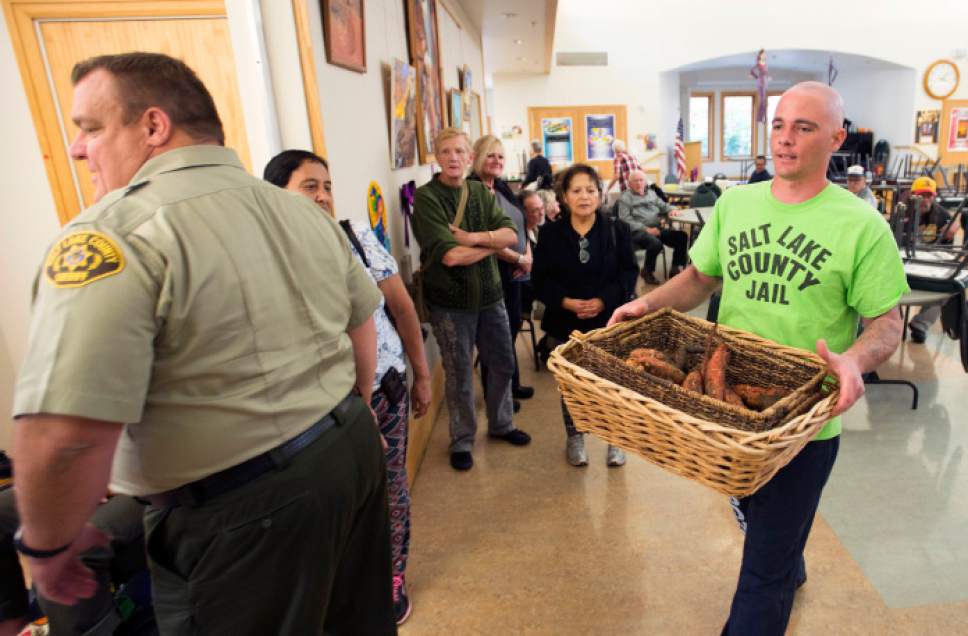 Steve Griffin / The Salt Lake Tribune


Salt Lake County Jail inmate Vinny Slack carries a basket of sweet potatoes into the Liberty Active Aging Center as the Salt Lake County Jail Horticulture Program sets up a modified farmers market for senior citizens in Salt Lake City Monday October 24, 2016. The Jail Horticulture Program has been donating their harvest to every active aging center at least once throughout the season. This year's harvest has been so bountiful they are making another round of visits. The Salt Lake County Jail Horticulture Program collaborates with the Salt Lake County Active Aging Center, Green Urban Lunchbox and U.S.U. Extension Program for the event. The jail's garden is about two acres and is located behind the jail on 900 west and 3300 south.
