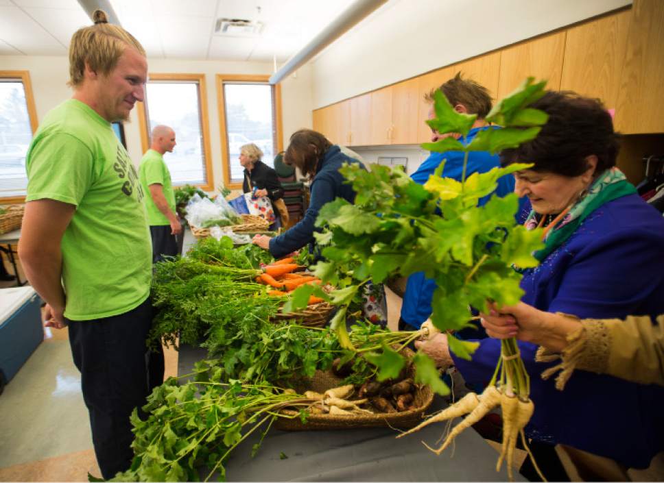 Steve Griffin / The Salt Lake Tribune


Salt Lake County Jail inmate Alex Harward smiles as senior citizens at the Liberty Active Aging Center shop for vegetables as the Salt Lake County Jail Horticulture Program holds a modified farmers market in Salt Lake City Monday October 24, 2016. The Jail Horticulture Program has been donating their harvest to every active aging center at least once throughout the season. This year's harvest has been so bountiful they are making another round of visits. The Salt Lake County Jail Horticulture Program collaborates with the Salt Lake County Active Aging Center, Green Urban Lunchbox and U.S.U. Extension Program for the event. The jail's garden is about two acres and is located behind the jail on 900 west and 3300 south.
