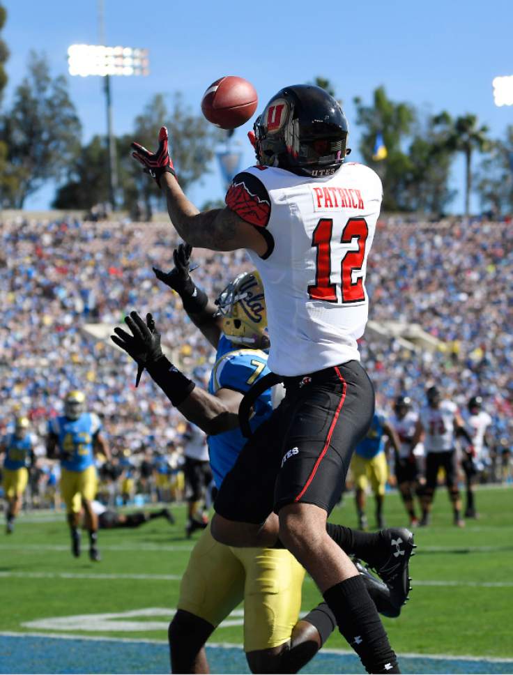 Utah wide receiver Tim Patrick, right, makes a catch in the end zone as UCLA defensive back John Johnson defends during the first half of an NCAA college football game, Saturday, Oct. 22, 2016, in Pasadena, Calif. The play was called back on a penalty. (AP Photo/Mark J. Terrill)