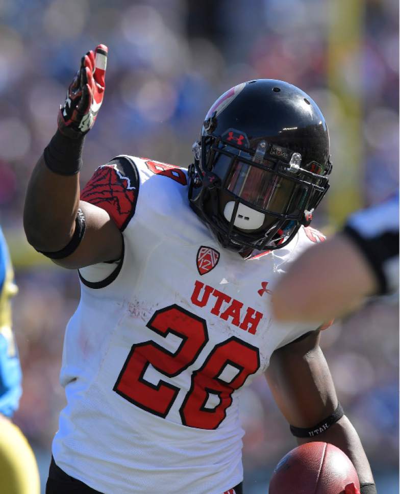 Utah running back Joe Williams celebrates after making a first down during the first half of an NCAA college football game against UCLA, Saturday, Oct. 22, 2016, in Pasadena, Calif. (AP Photo/Mark J. Terrill)