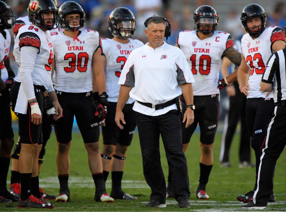 Utah head coach Kyle Whittingham stands with members of his team during the second half of an NCAA college football game against UCLA, Saturday, Oct. 22, 2016, in Pasadena, Calif. Utah won 52-45. (AP Photo/Mark J. Terrill)