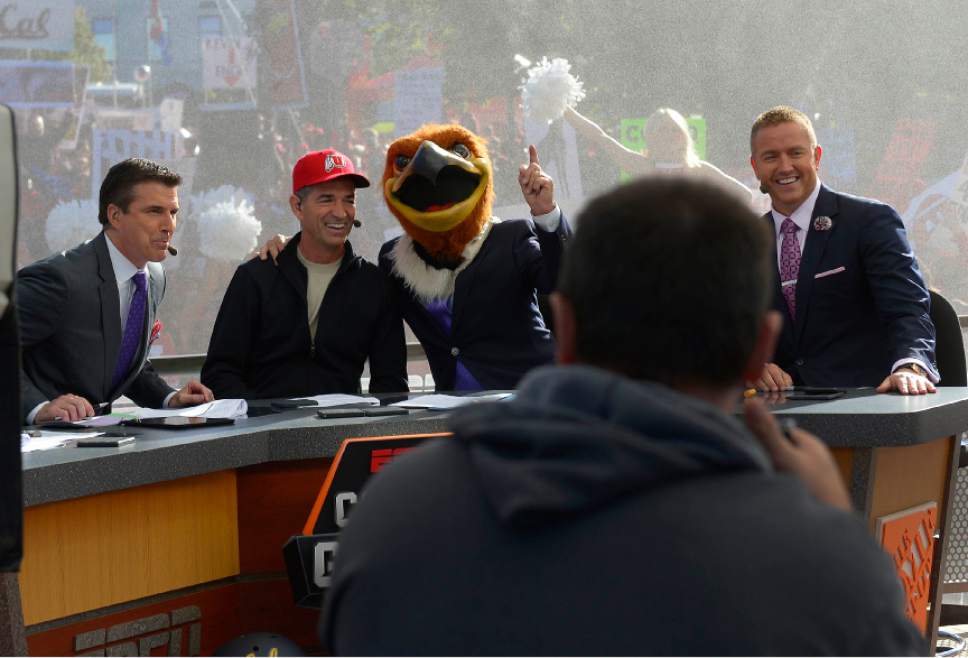 Leah Hogsten  |  The Salt Lake Tribune
l-r ESPN's "College GameDay," cast Rece Davis, local celebrity John Stockton, Lee Corso and Kirk Herbstreit laugh as Corso places the head of Swoop, Utah's mascot, on his head, predicting the Utes will win the game. Hundreds of fans cheered for their teams Saturday, October 10, 2015, at The University of Utah's President's Circle, during the filming of ESPN's "College GameDay," a sports television show that previews and predicts winners of the nation's college football games and picked No. 5 Utah to beat No. 23 Cal.