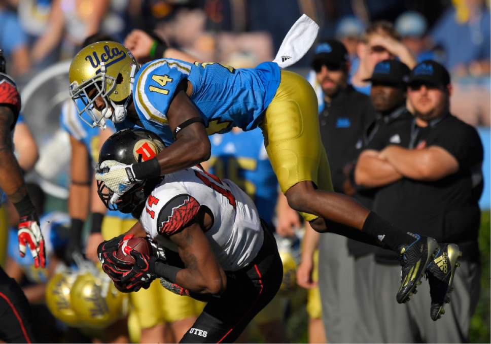 Utah defensive back Brian Allen, below, intercepts a pass intended for UCLA wide receiver Theo Howard during the second half of an NCAA college football game, Saturday, Oct. 22, 2016, in Pasadena, Calif. Utah won 52-45. (AP Photo/Mark J. Terrill)
