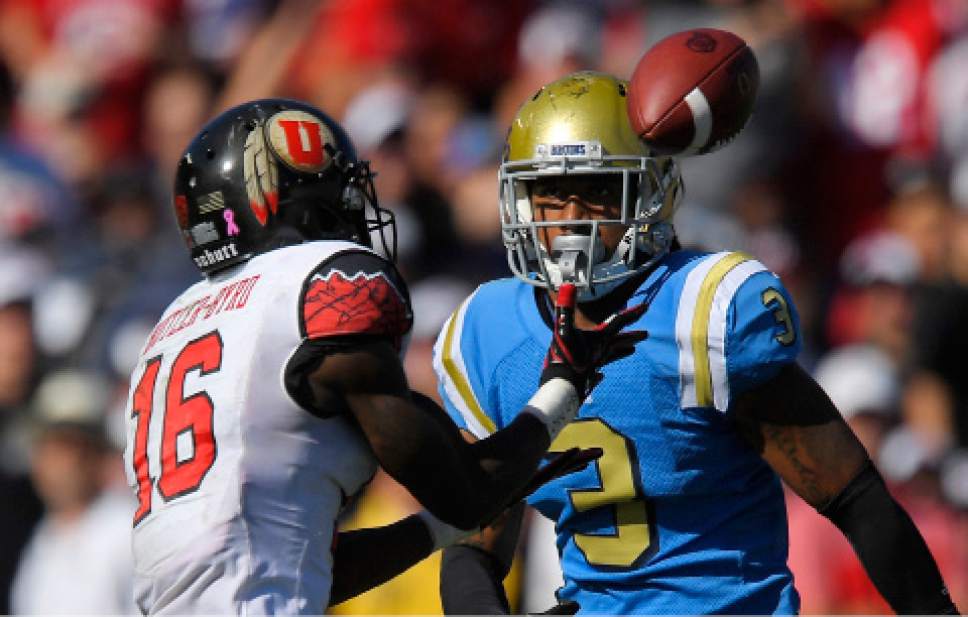 Utah wide receiver Cory Butler-Byrd, left, makes a catch as UCLA defensive back Randall Goforth defends during the first half of an NCAA college football game, Saturday, Oct. 22, 2016, in Pasadena, Calif. (AP Photo/Mark J. Terrill)