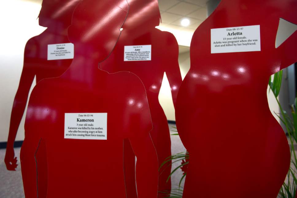 Leah Hogsten  |  The Salt Lake Tribune
Red and white silhouette cut-outs fill the lobby of West Valley City Hall and represent victims of domestic violence. The month of October is Domestic Violence Awareness Month and the West Valley City Police Department hopes to increase awareness about domestic violence.