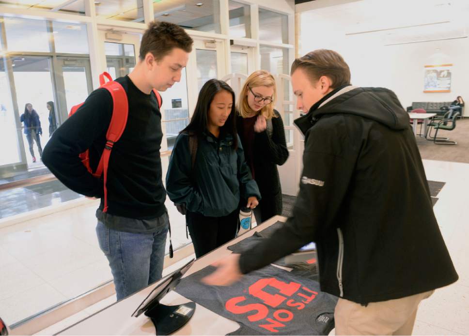 Al Hartmann  |  The Salt Lake Tribune
Derek Eyre with ASUU, right, asks University of Utah students to sign the "It's on Us" pledge and have their picture taken with signs displaying messages of empowerment and support for sexual assault victims at the Marriott Library Monday October 24.  They received T-shirts for the pledge.  
The university conducted a campus climate survey, and most students say they have no idea where to report assaults.