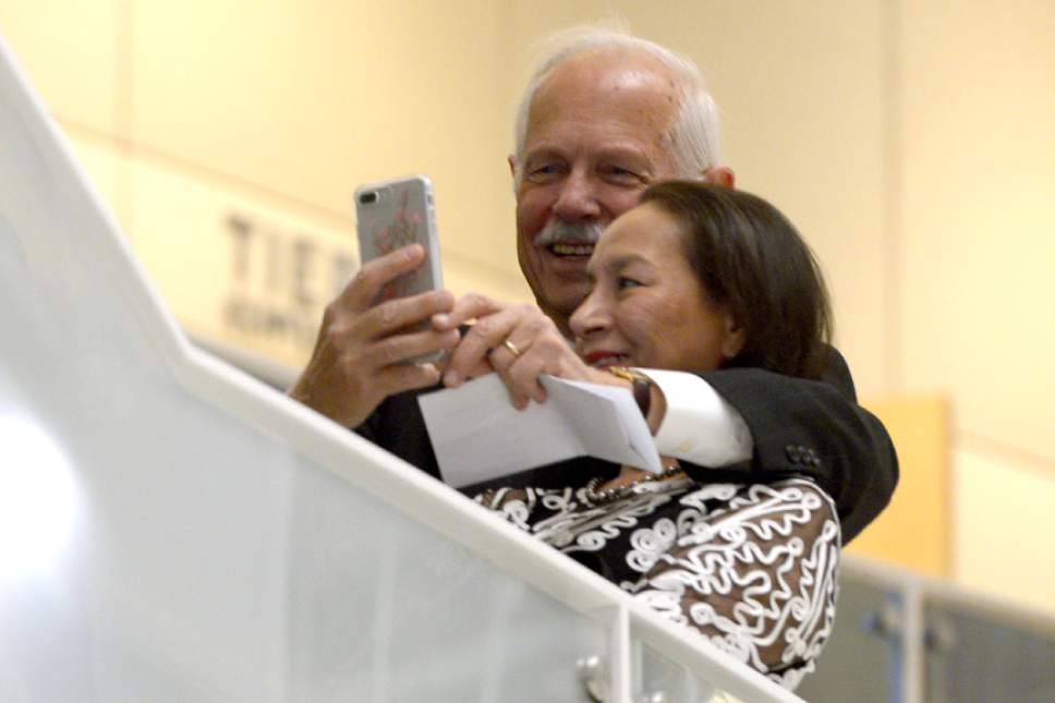 Leah Hogsten  |  The Salt Lake Tribune
A couple struggles while trying to take a selfie picture at Salt Lake City's George S. and Dolores Doré Eccles Theater's opening festivities, October 21, 2016.  The night  featured entertainment legend Rita Moreno, who emceed a lineup that including fellow Tony winner Brian Stokes Mitchell, Tony-nominated Megan Hilty and performers from many of Salt Lake City's top music, dance and theater organizations as pianist Kurt Bestor conducted the 60-piece Ballet West Orchestra. The theatre's grand opening  weekend features a day of free performances Saturday and a rare on-the-road broadcast of the Mormon Tabernacle Choir's "Music and the Spoken Word" on Sunday.