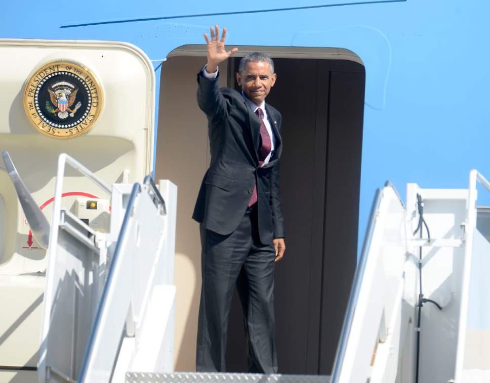 Al Hartmann  |  The Salt Lake Tribune 
President Barack Obama gives a last wave from stairs of Air Force One before departing from Hill Air Force Base at 11:20 a.m. Friday April 3.
