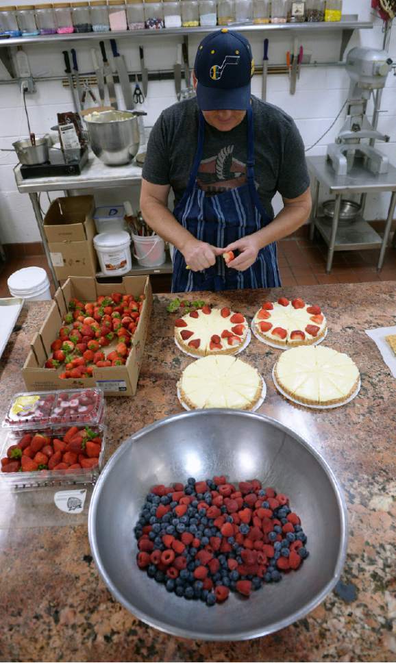 Al Hartmann  |  The Salt Lake Tribune
Martin Perham, owner of Martin's Fine Desserts, decorates custard tarts with fresh strawberry, rasberry and blueberries for the the Vivint Smart Home Arena. Perham has been a baker for the Utah Jazz for 25 years, making the  cakes, fruit tarts and other sweet treats for fans in the fine diining clubs, banquet rooms and luxury suites.