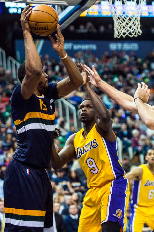 Chris Detrick  |  The Salt Lake Tribune
Utah Jazz forward Derrick Favors (15) is guarded by Los Angeles Lakers forward Luol Deng (9) during the game at Vivint Smart Home Arena Friday October 28, 2016.