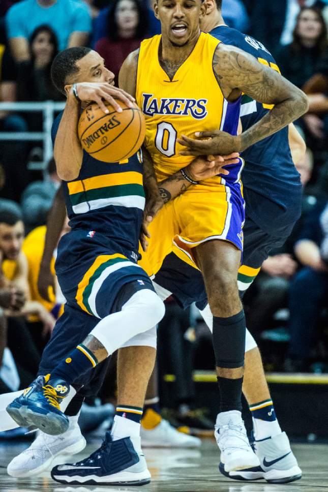Chris Detrick  |  The Salt Lake Tribune
Utah Jazz guard George Hill (3) is fouled by Los Angeles Lakers forward Nick Young (0) during the game at Vivint Smart Home Arena Friday October 28, 2016. Utah Jazz defeated Los Angeles Lakers 96-89.