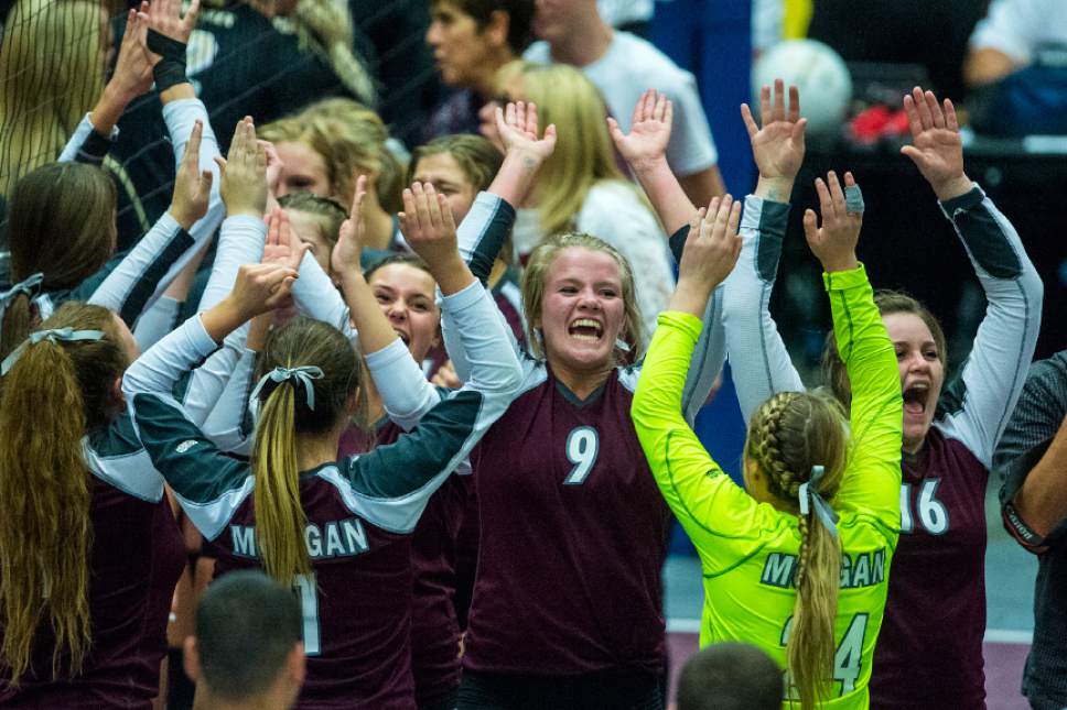 Chris Detrick  |  The Salt Lake Tribune
Members of the Morgan volleyball team celebrate after winning the Class 3A state volleyball championship match Thursday October 27, 2016. Morgan defeated Desert Hills 3-0.