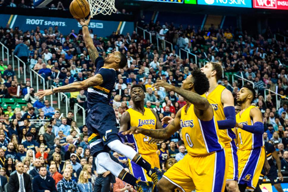 Chris Detrick  |  The Salt Lake Tribune
Utah Jazz guard George Hill (3) shoots past Los Angeles Lakers forward Julius Randle (30) and Los Angeles Lakers forward Nick Young (0) during the game at Vivint Smart Home Arena Friday October 28, 2016.