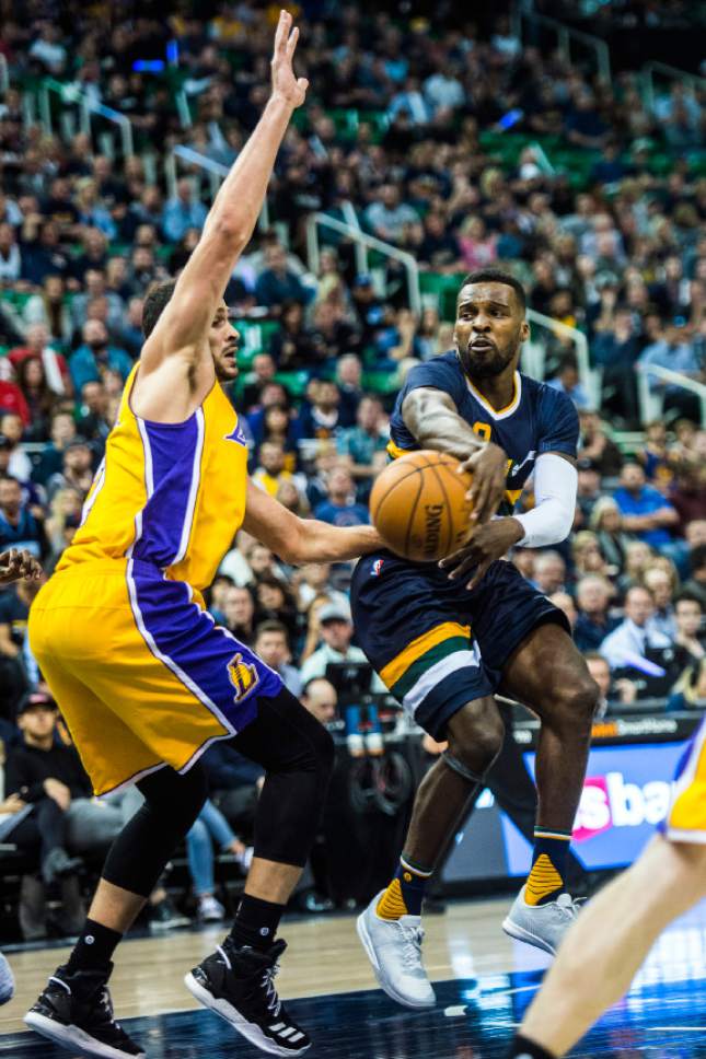 Chris Detrick  |  The Salt Lake Tribune
Utah Jazz guard Shelvin Mack (8) passes around Los Angeles Lakers forward Larry Nance Jr. (7) during the game at Vivint Smart Home Arena Friday October 28, 2016.