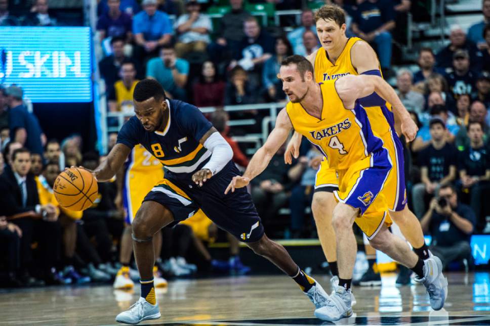 Chris Detrick  |  The Salt Lake Tribune
Utah Jazz guard Shelvin Mack (8) and Los Angeles Lakers guard Marcelo Huertas (4) go for the ball during the game at Vivint Smart Home Arena Friday October 28, 2016.