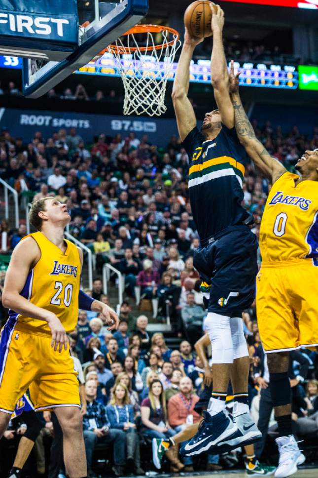 Chris Detrick  |  The Salt Lake Tribune
Utah Jazz center Rudy Gobert (27) dunks past Los Angeles Lakers forward Nick Young (0) during the game at Vivint Smart Home Arena Friday October 28, 2016.