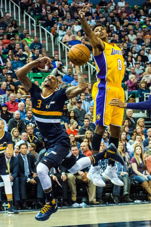 Chris Detrick  |  The Salt Lake Tribune
Los Angeles Lakers forward Nick Young (0) fouls Utah Jazz guard George Hill (3) during the game at Vivint Smart Home Arena Friday October 28, 2016.