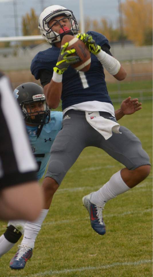 Leah Hogsten  |  The Salt Lake Tribune
Syracuse's NJ Mo'o pulls down the catch. Syracuse High School  West Jordan High School in the opening round of the Class 5A football playoffs, Friday, October 28, 2016.