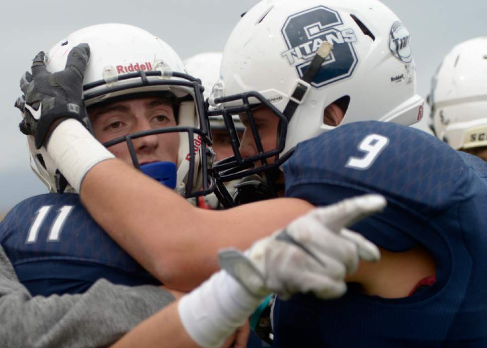 Leah Hogsten  |  The Salt Lake Tribune
Syracuse's Brennon Jones hauls in a 55-yard touchdown. Syracuse High School battles West Jordan High School in the opening round of the Class 5A football playoffs, Friday, October 28, 2016.