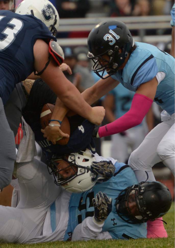 Leah Hogsten  |  The Salt Lake Tribune
Syracuse quarterback Ty Metcalfe is sacked.  Syracuse High School battles West Jordan High School in the opening round of the Class 5A football playoffs, Friday, October 28, 2016.