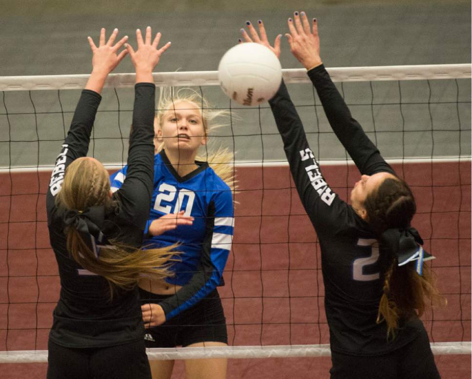 Rick Egan  |  The Salt Lake Tribune

Panguitch Bobcats Jordan Bennett (20) hits the ball past  the Rich Rebel defenders, in State 1A volleyball action Panguitch Bobcats vs. the Rich Rebels, Saturday, October 29, 2016.