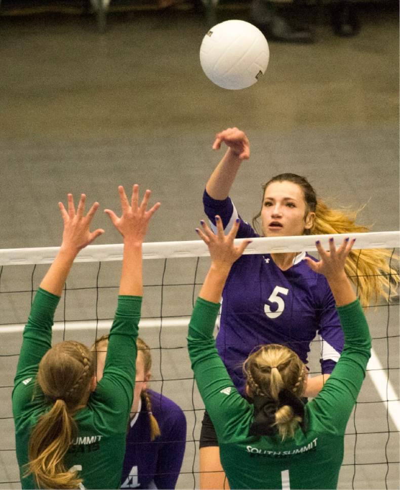 Rick Egan  |  The Salt Lake Tribune

North Summitt Braves Hunter  Vernon (5) hits the ball past South Summit defenders, in the 2A Volleyball championship game, Saturday, October 29, 2016.