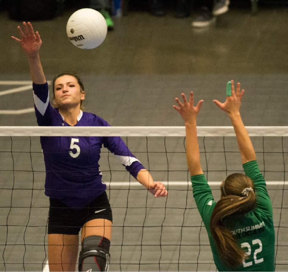 Rick Egan  |  The Salt Lake Tribune

North Summitt Braves Hunter  Vernon (5) hits the ball past South Summit defender Jessa Gines (22), in the 2A Volleyball championship game, Saturday, October 29, 2016.