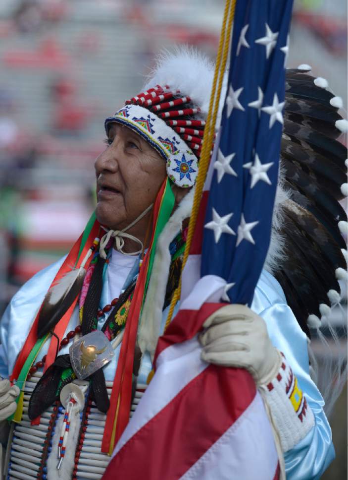 Leah Hogsten  |  The Salt Lake Tribune
Ute Tribe Elder Jonas Grant Sr. carries in the American Flag in the Honor Guard. The No. 4  University of Washington Huskies and No. 17 University of Utah Utes will converge in the biggest game in Utah's Pac-12 era at Rice-Eccles Stadium, Saturday, October 29, 2016.