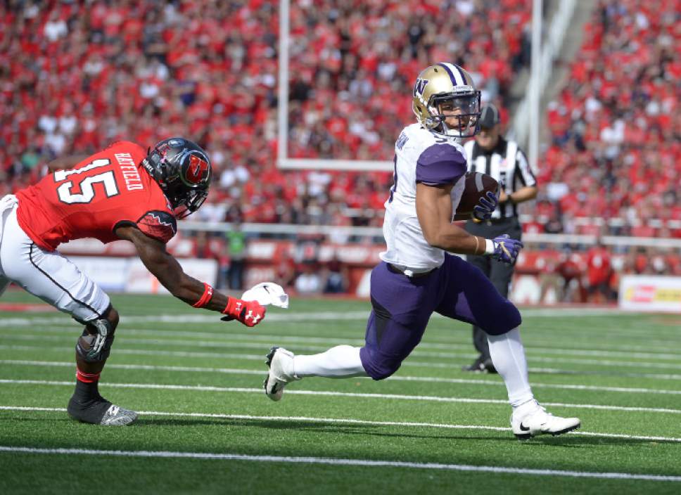 Leah Hogsten  |  The Salt Lake Tribune
Washington Huskies running back Myles Gaskin (9) can't be stopped by Utah Utes defensive back Dominique Hatfield (15) on his touchdown run. University of Washington Huskies lead University of Utah Utes 14-10 during the first half of their game at Rice-Eccles Stadium, Saturday, October 29, 2016.